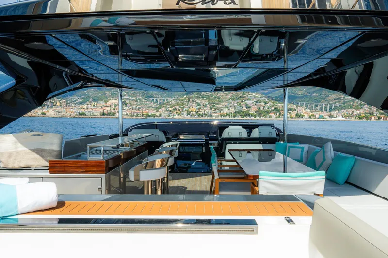  Yacht Photos Pics Luxurious 2022 Riva 90' Argo yacht interior with elegant seating and stunning sea view.