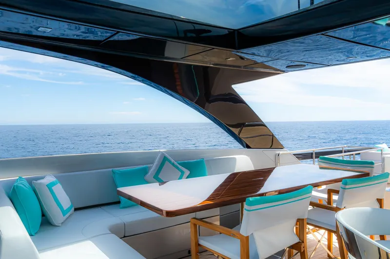  Yacht Photos Pics Luxurious 2022 Riva 90' Argo yacht deck with elegant seating and ocean view.