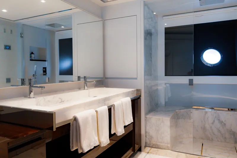  Yacht Photos Pics Luxurious bathroom on 2022 Riva 90' Argo yacht with marble finishes and modern fixtures.