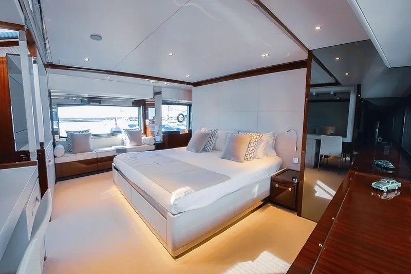  Yacht Photos Pics Luxurious bedroom interior of 2022 Riva 90' Argo yacht with modern design and elegant furnishings.