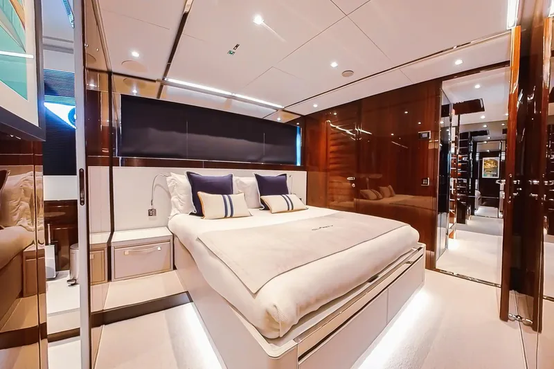  Yacht Photos Pics Luxurious bedroom interior of 2022 Riva 90' Argo yacht with modern design and elegant furnishings.