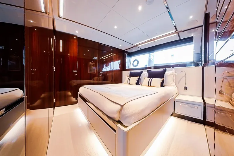  Yacht Photos Pics Luxurious bedroom interior of 2022 Riva 90' Argo yacht with modern design.