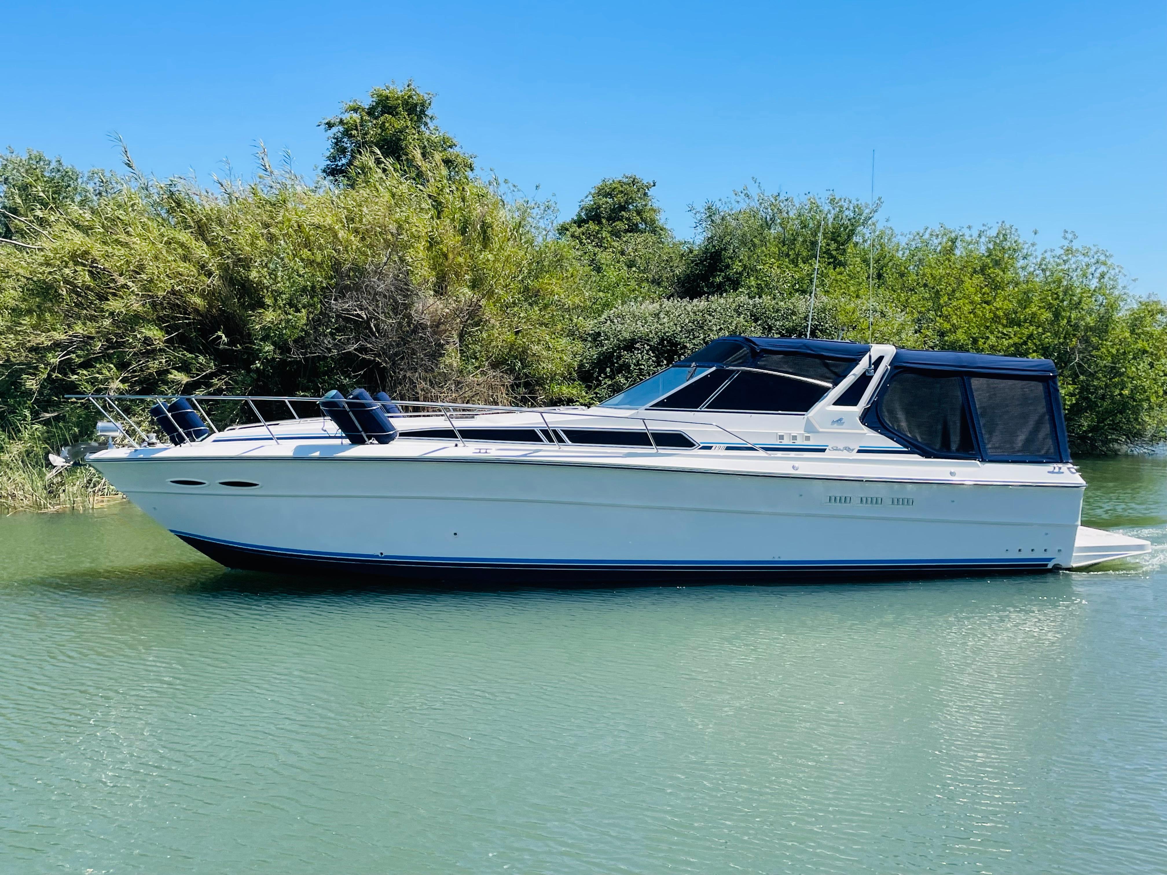 1989 Sea Ray 390 Express Cruiser on calm water.