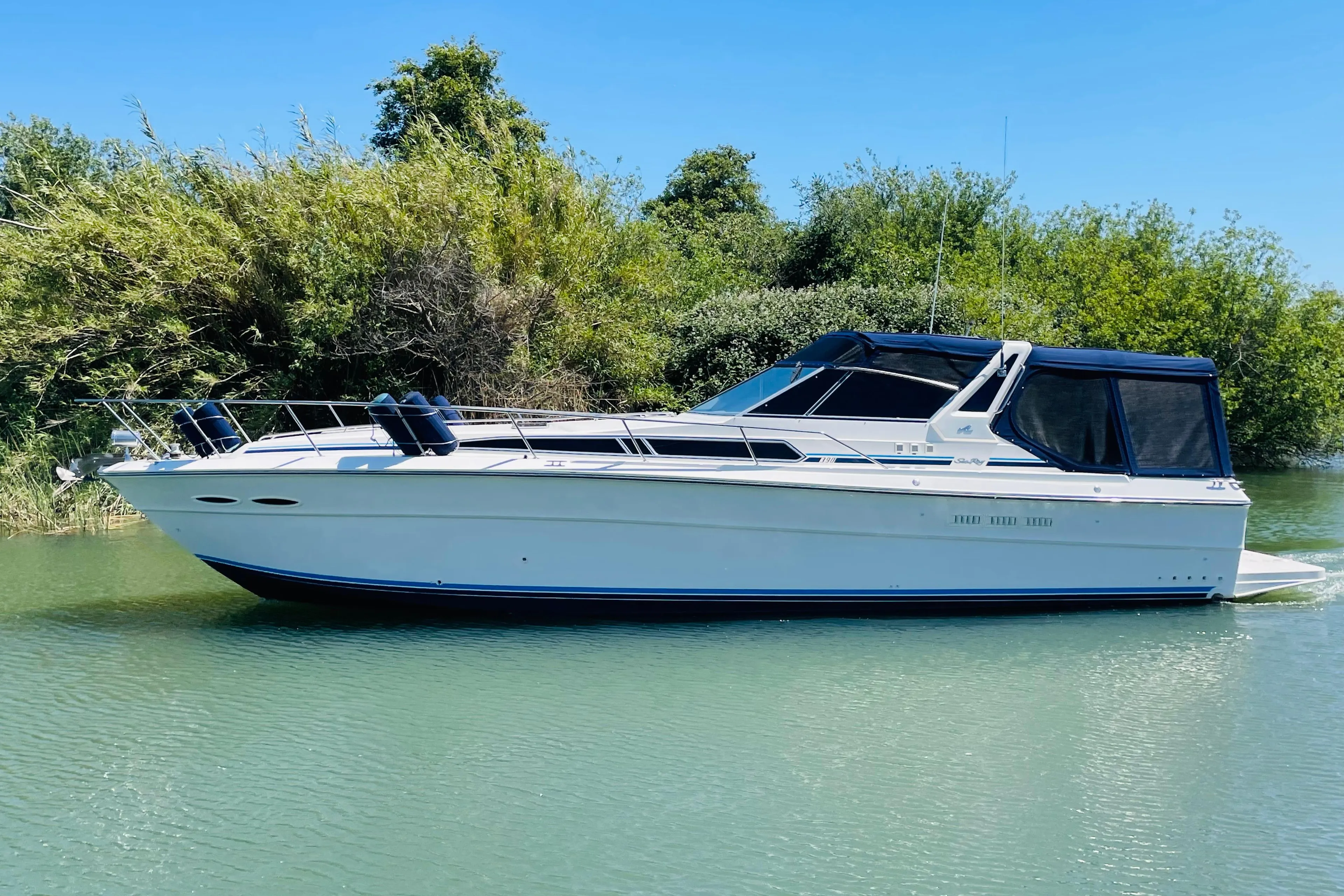 1989 Sea Ray 390 Express Cruiser on calm water.