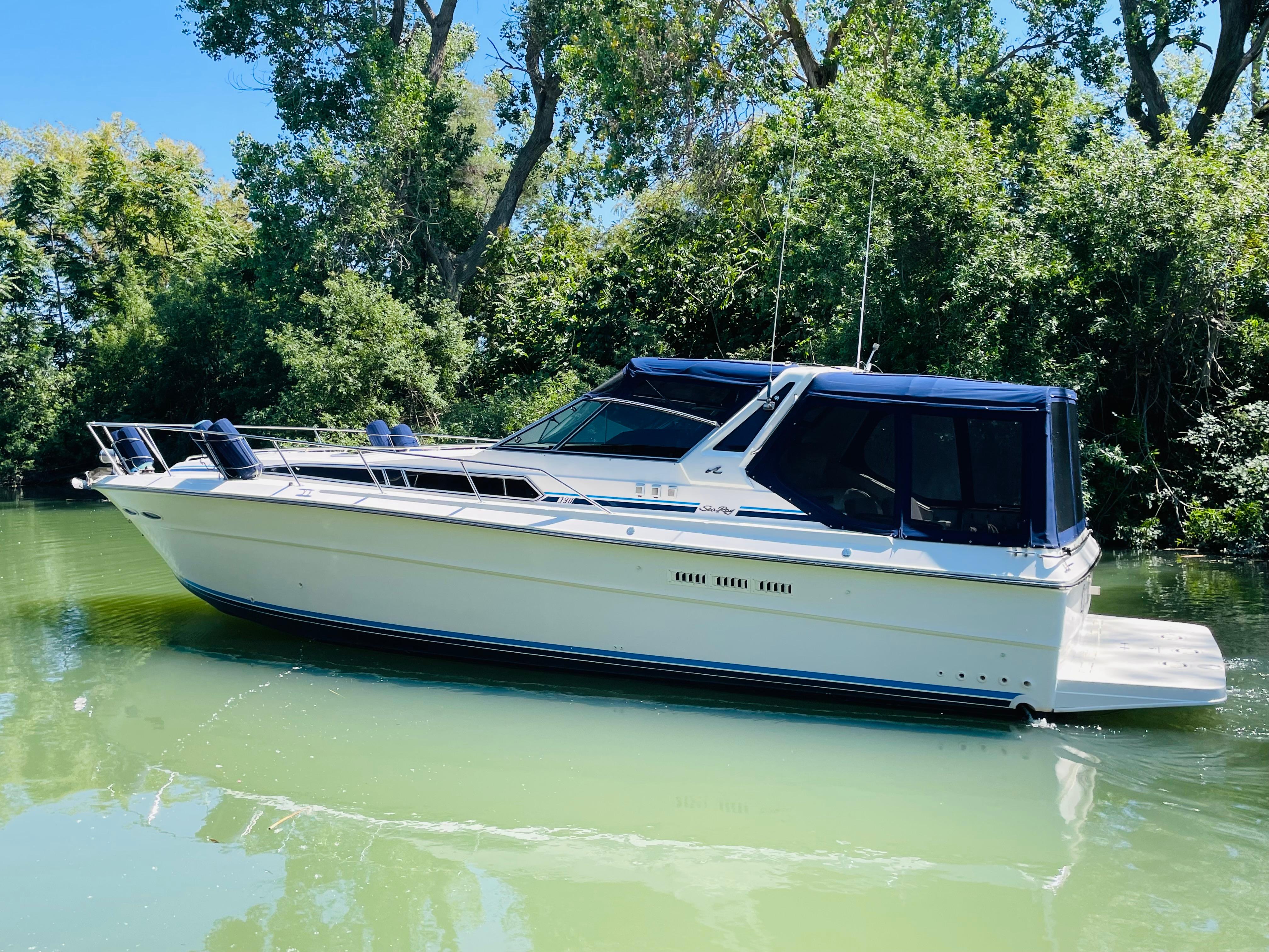 1989 Sea Ray 390 Express Cruiser on calm water.