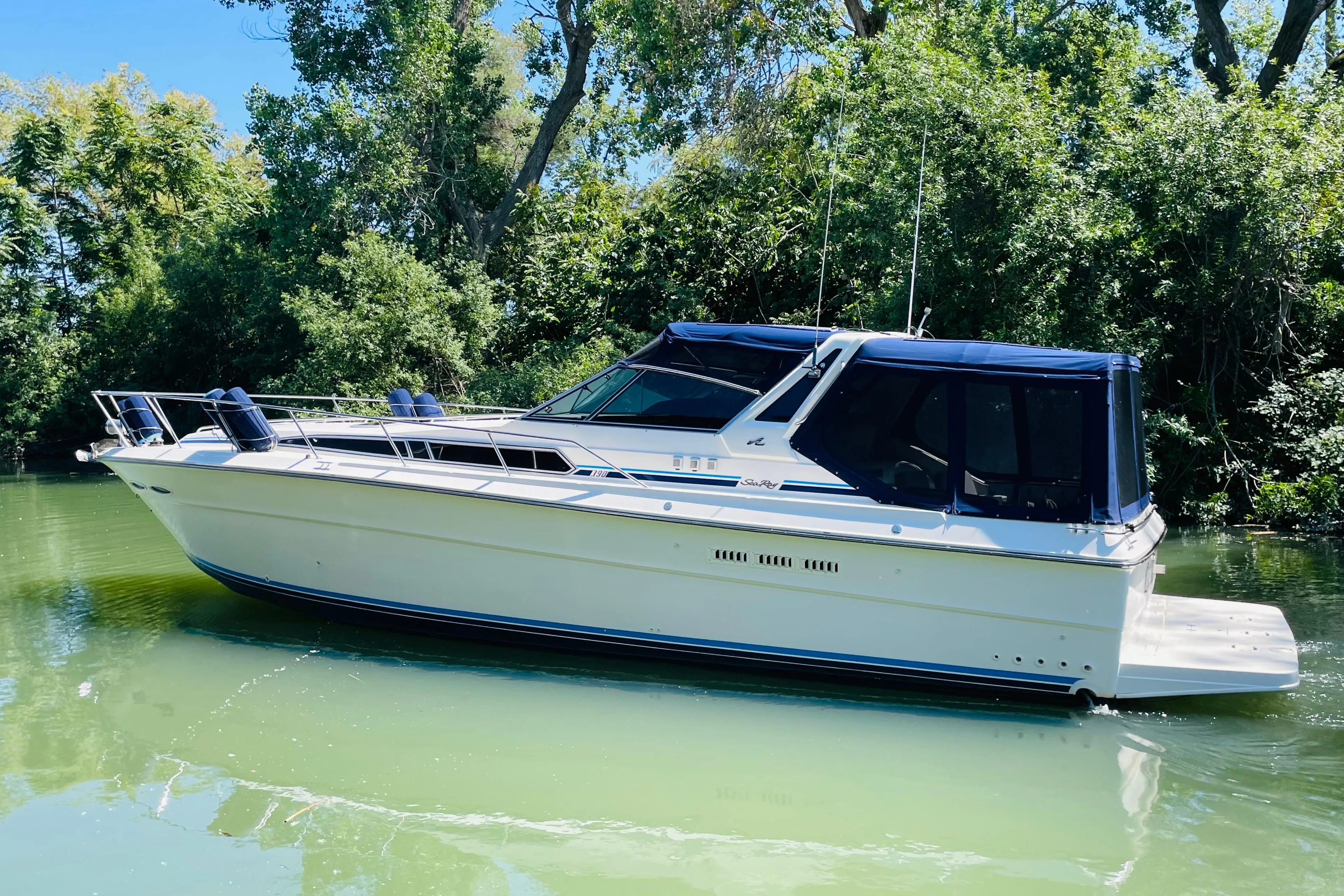 1989 Sea Ray 390 Express Cruiser on calm water.