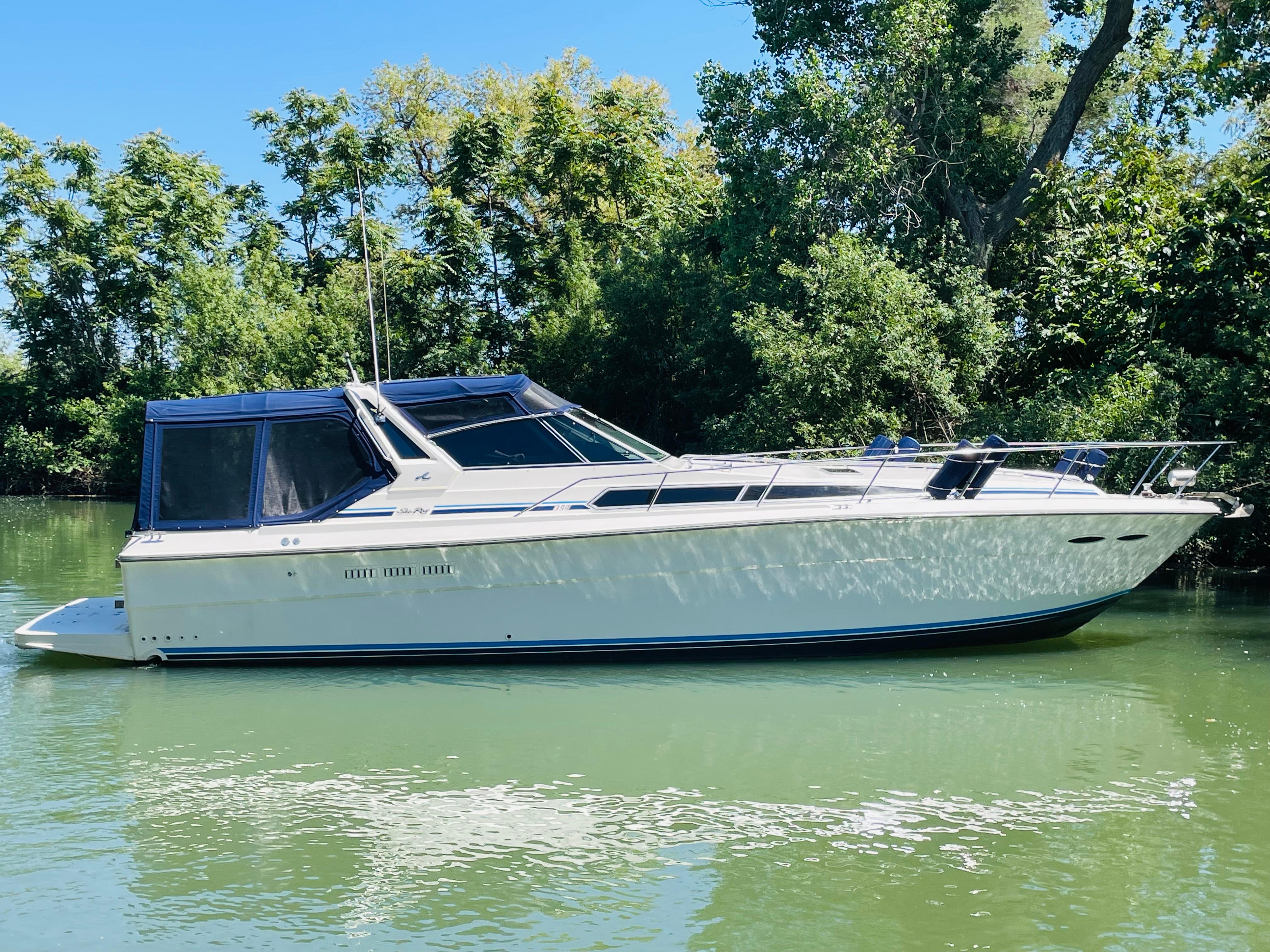 1989 Sea Ray 390 Express Cruiser on calm water.
