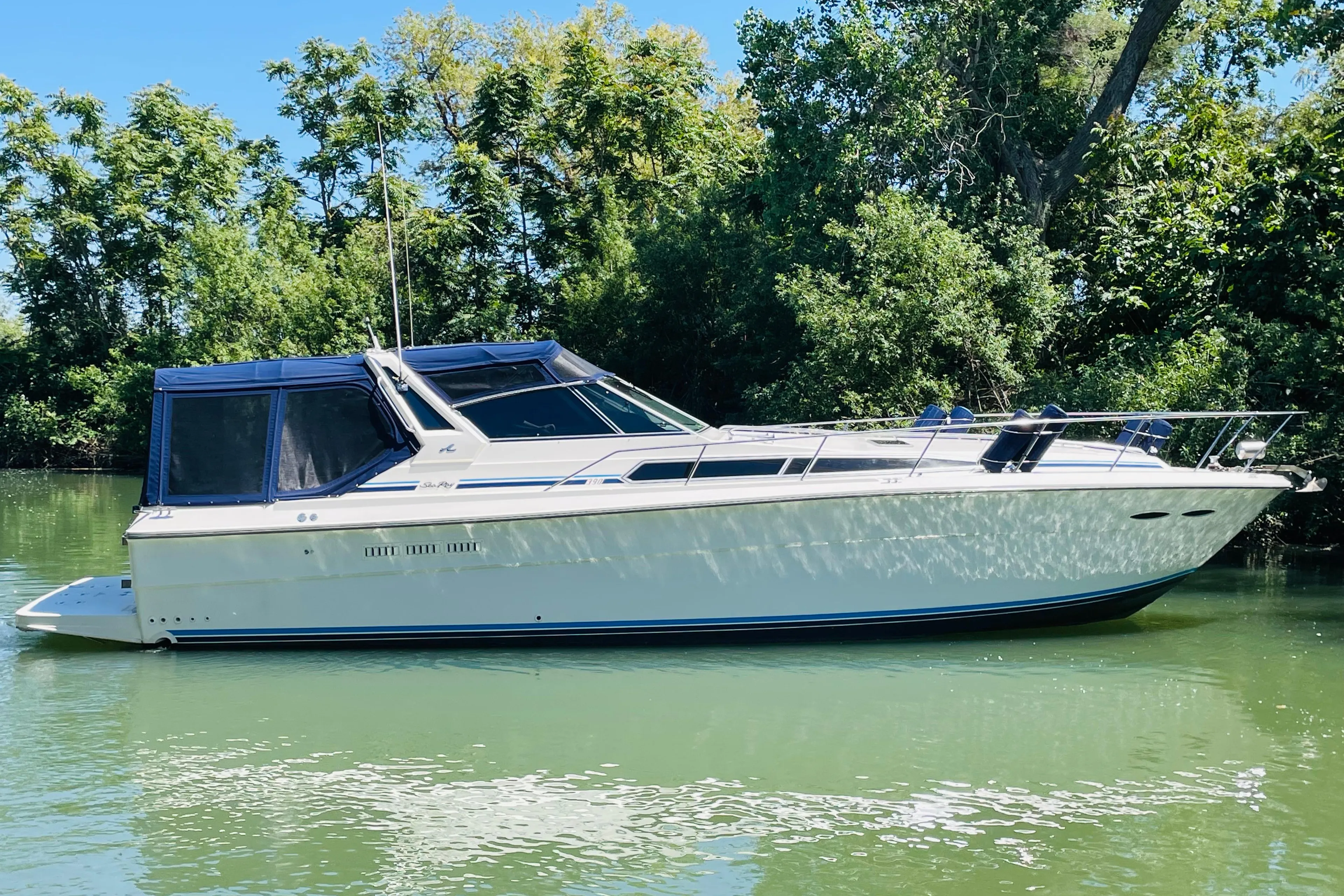 1989 Sea Ray 390 Express Cruiser on calm water.