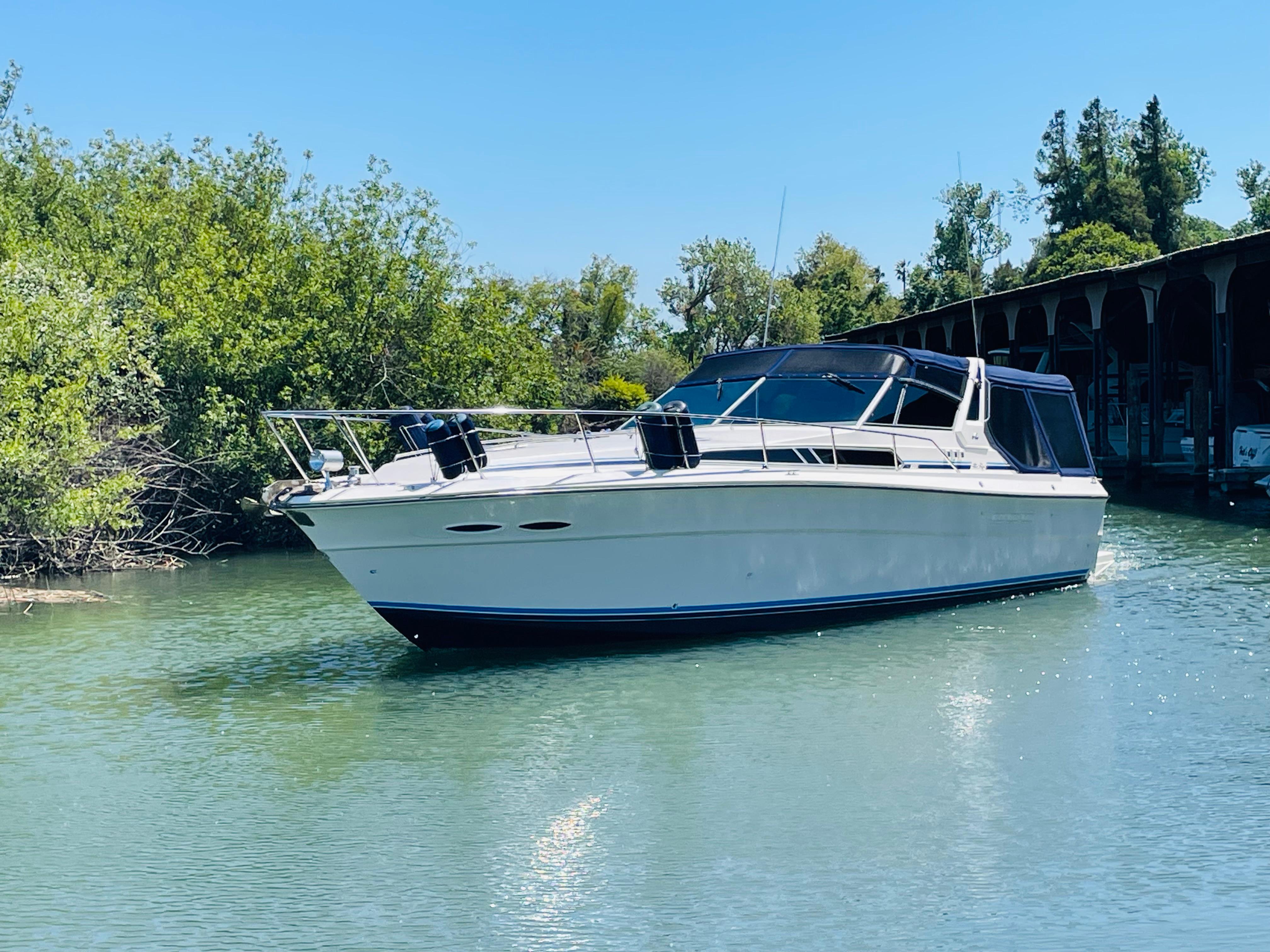 1989 Sea Ray 390 Express Cruiser on calm water.