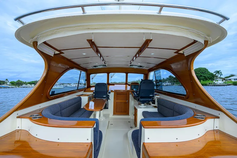 Gotcha Covered Yacht Photos Pics Interior of 2006 Hinckley Talaria 40 yacht with elegant wood finish and seating.