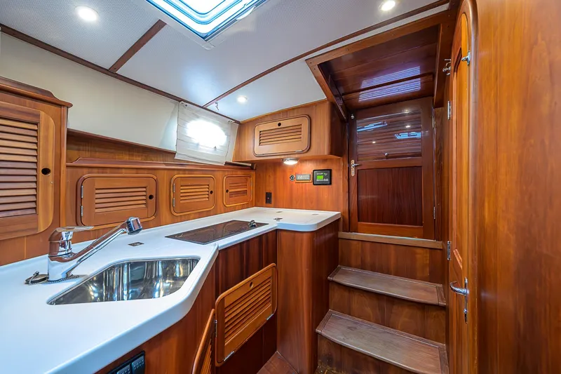 Gotcha Covered Yacht Photos Pics Luxurious 2006 Hinckley Talaria 40 yacht interior with elegant wood cabinetry and modern amenities.