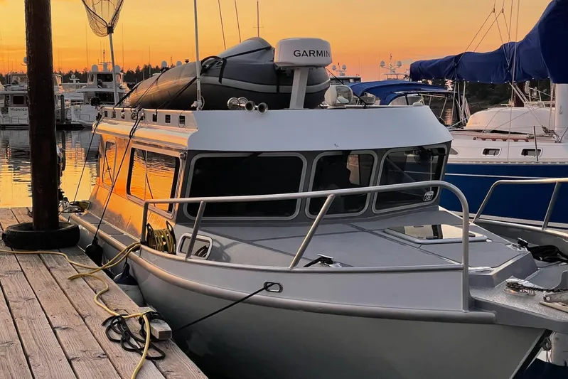  Yacht Photos Pics 2015 River Hawk SH Offshore XL boat docked at sunset with Garmin equipment.