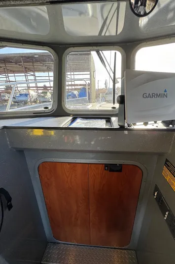  Yacht Photos Pics Interior of 2015 River Hawk SH Offshore XL boat with Garmin navigation system.