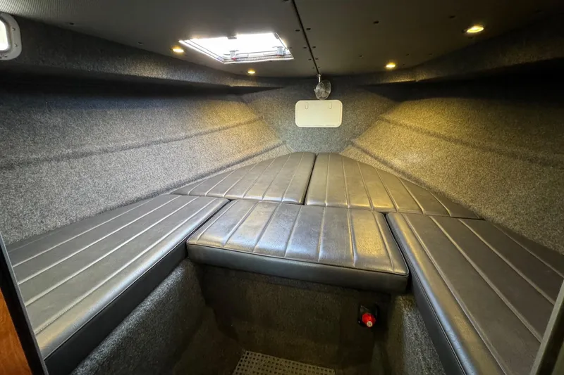  Yacht Photos Pics 2015 River Hawk SH Offshore XL cabin interior with cushioned seating and overhead lighting.