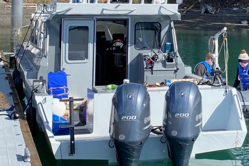  Yacht Photos Pics 2015 River Hawk SH Offshore XL boat with dual Yamaha 200 engines docked at a marina.