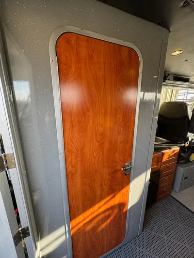  Yacht Photos Pics Interior cabin door of 2015 River Hawk SH Offshore XL boat.