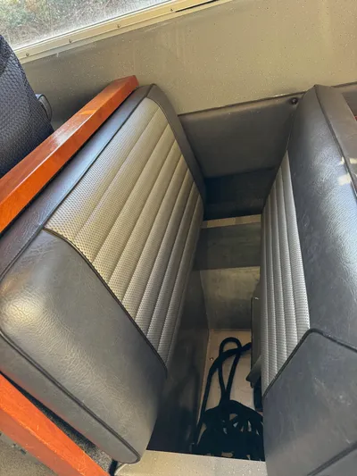  Yacht Photos Pics 2015 River Hawk SH Offshore XL boat interior with cushioned seating.