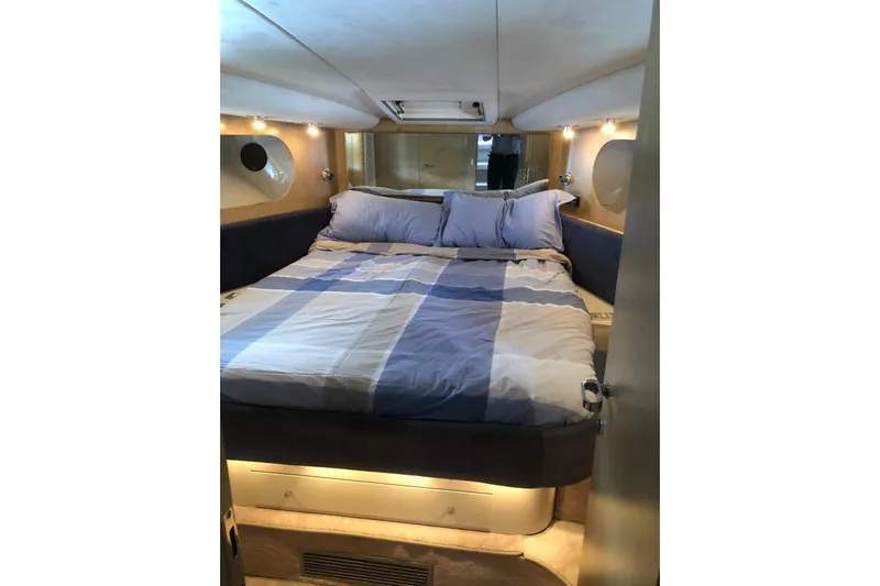  Yacht Photos Pics Luxurious cabin interior of 1992 Riva TROPICANA 43 yacht with cozy bedding.