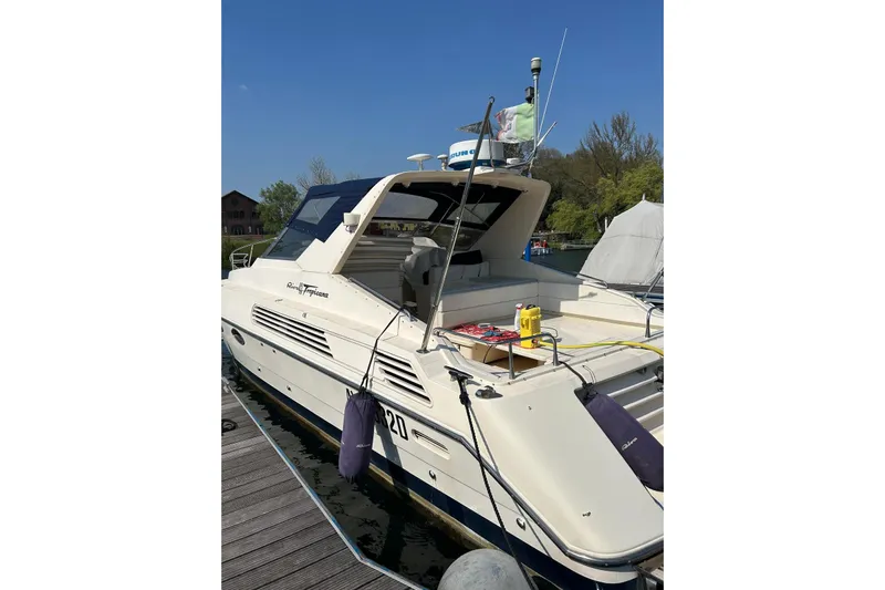  Yacht Photos Pics 1992 Riva Tropicana 43 yacht docked, featuring sleek design and modern amenities.