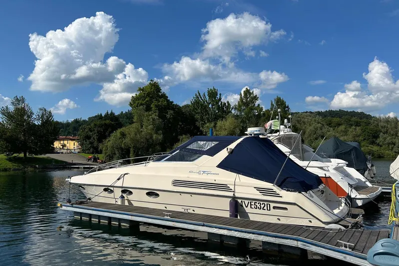  Yacht Photos Pics Riva TROPICANA 43 yacht, 1992 model, docked on a sunny day with blue skies.