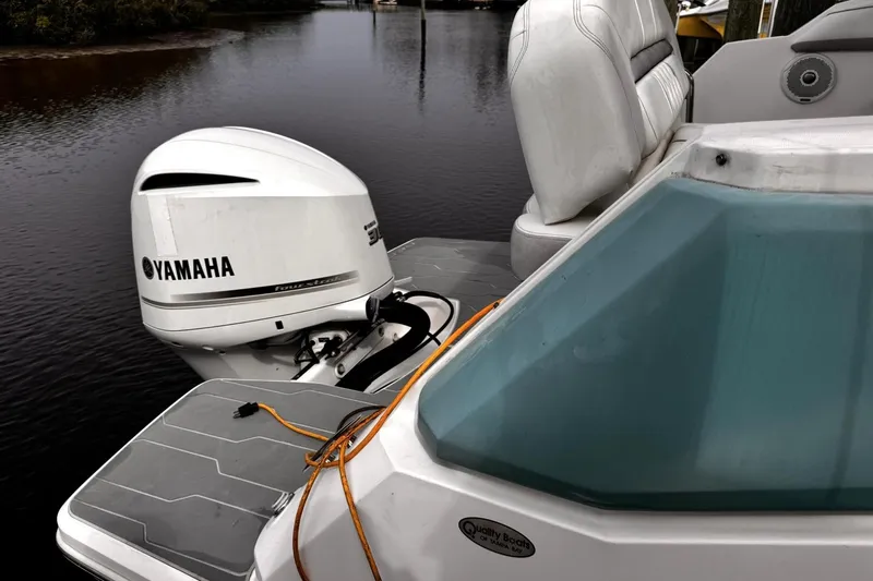  Yacht Photos Pics 2021 Regal 26 XO boat with Yamaha outboard motor on calm water.