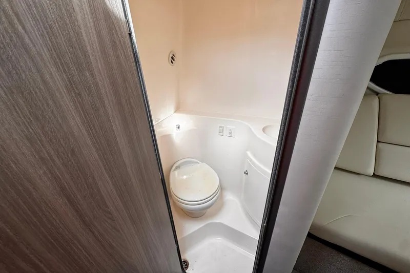  Yacht Photos Pics 2021 Regal 26 XO boat interior bathroom with compact toilet and modern design.