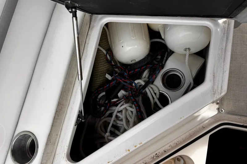  Yacht Photos Pics Open storage compartment on 2021 Regal 26 XO boat with ropes and fenders.