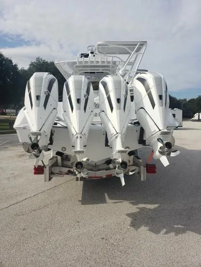  Yacht Photos Pics 2023 Yellowfin 39 Offshore boat with four powerful outboard engines, rear view.
