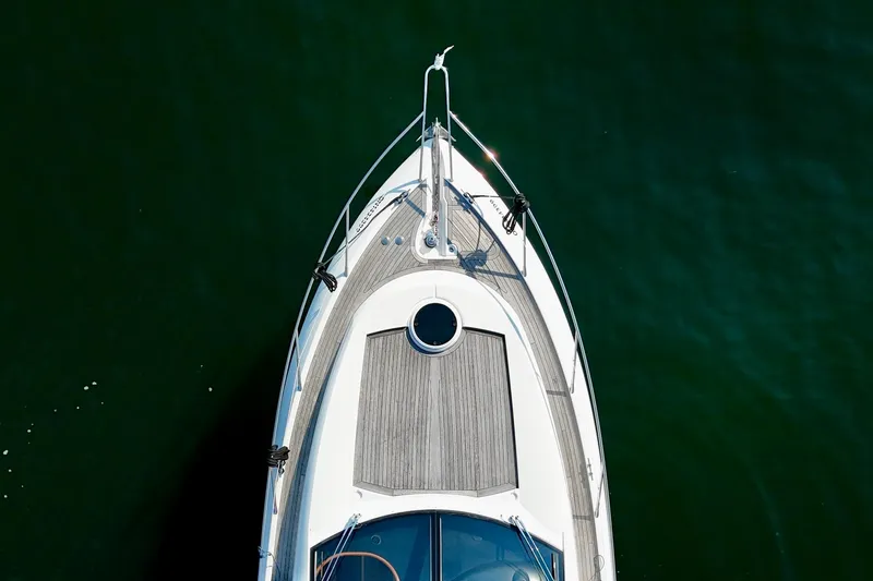 Why Not Yacht Photos Pics Aerial view of 2005 Sunseeker Manhattan 50 yacht on calm water.