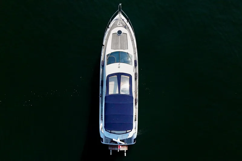 Why Not Yacht Photos Pics Aerial view of 2005 Sunseeker Manhattan 50 yacht on dark water.