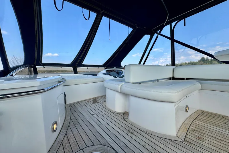 Why Not Yacht Photos Pics Interior view of 2005 Sunseeker Manhattan 50 yacht with sleek seating and panoramic windows.