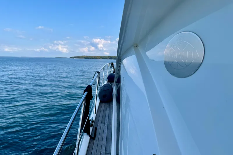 Why Not Yacht Photos Pics 2005 Sunseeker Manhattan 50 yacht cruising on calm blue waters.