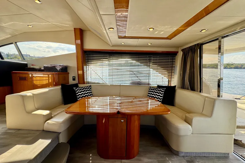 Why Not Yacht Photos Pics Luxurious interior of 2005 Sunseeker Manhattan 50 yacht with elegant dining area.