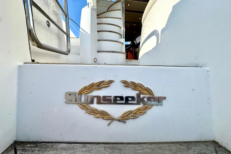 Why Not Yacht Photos Pics 2005 Sunseeker Manhattan 50 yacht entrance with logo and elegant design details.