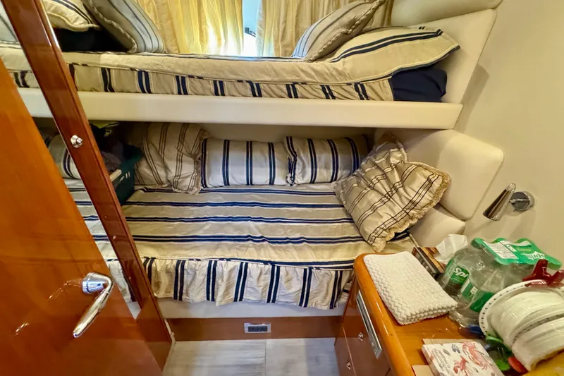 Why Not Yacht Photos Pics Bunk beds in 2005 Sunseeker Manhattan 50 yacht cabin with striped bedding.