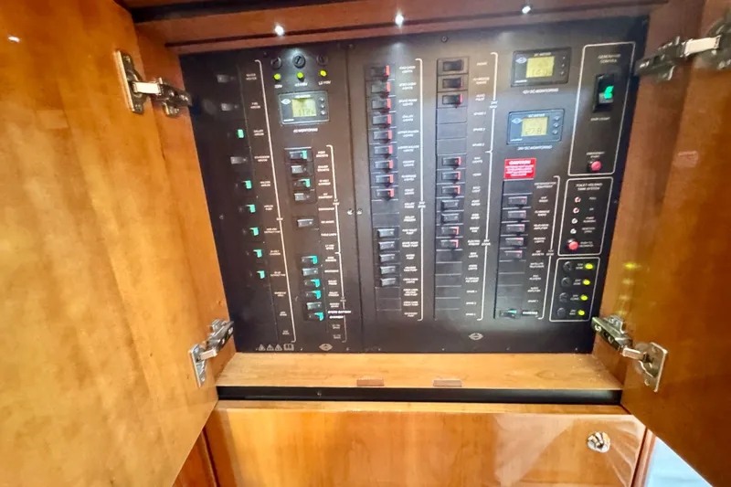 Why Not Yacht Photos Pics Electrical control panel inside 2005 Sunseeker Manhattan 50 yacht, featuring switches and indicators.