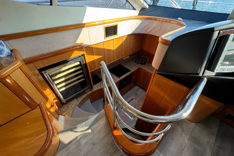 Why Not Yacht Photos Pics Luxurious interior of 2005 Sunseeker Manhattan 50 yacht, featuring elegant wood finishes and modern amenities.