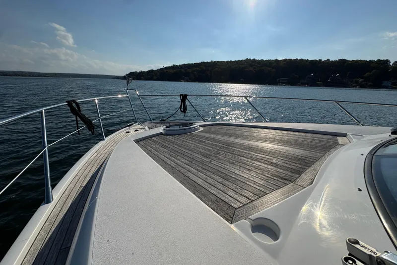 Why Not Yacht Photos Pics Sunseeker Manhattan 50 yacht deck, 2005 model, cruising on a sunny lake.