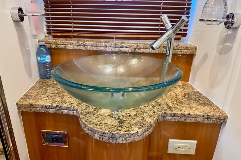 Why Not Yacht Photos Pics Glass bowl sink on granite countertop in 2005 Sunseeker Manhattan 50 yacht bathroom.