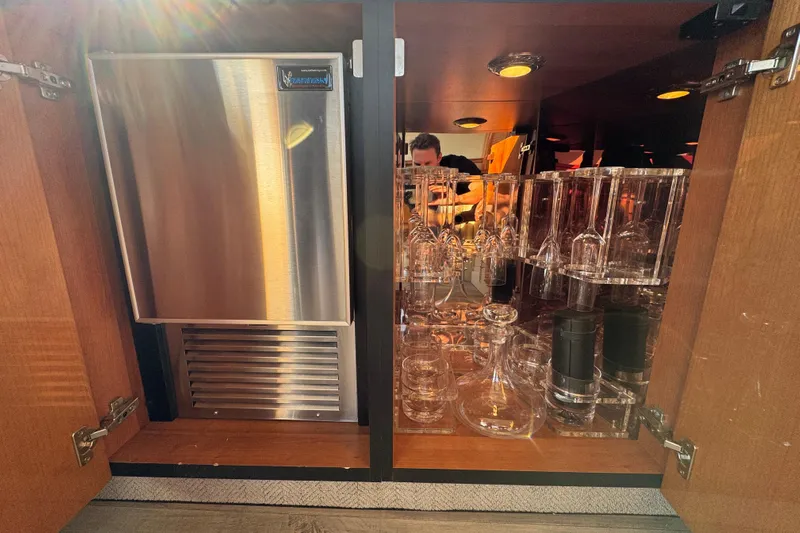 Why Not Yacht Photos Pics Luxury yacht Sunseeker Manhattan 50 interior with glassware and stainless steel appliance, 2005 model.