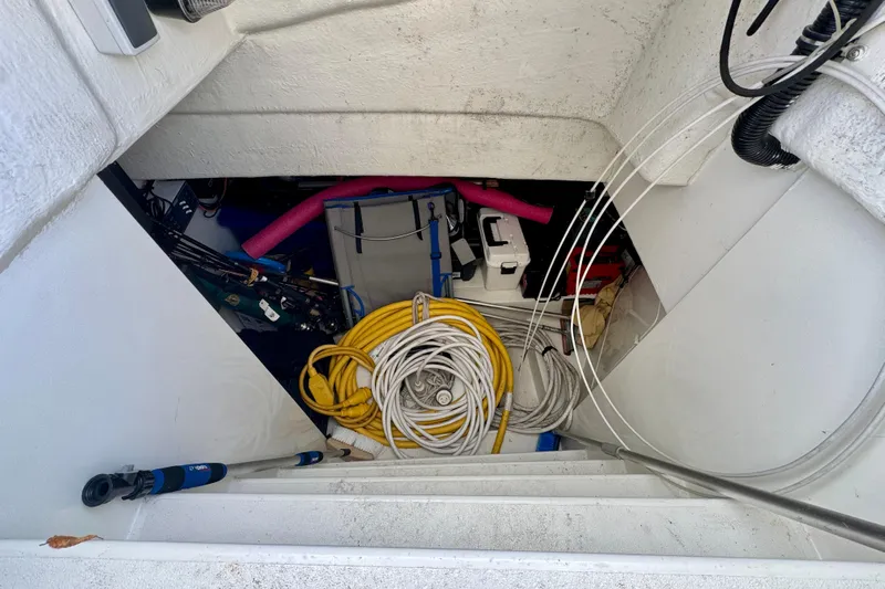 Why Not Yacht Photos Pics Storage compartment on a 2005 Sunseeker Manhattan 50 yacht, filled with cables and equipment.