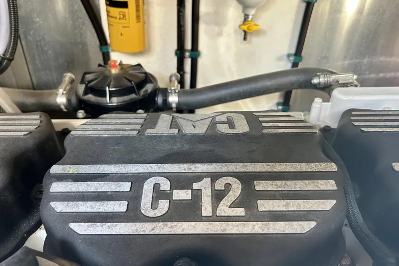 Why Not Yacht Photos Pics Engine compartment of a 2005 Sunseeker Manhattan 50 yacht featuring a CAT C-12 engine.