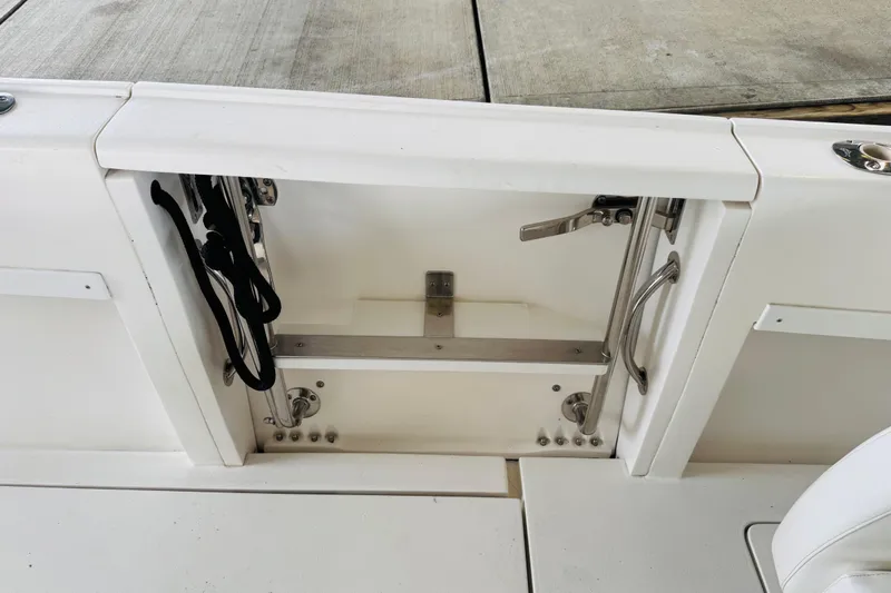  Yacht Photos Pics 2008 Intrepid 327 boat interior compartment with stainless steel fittings and storage space.