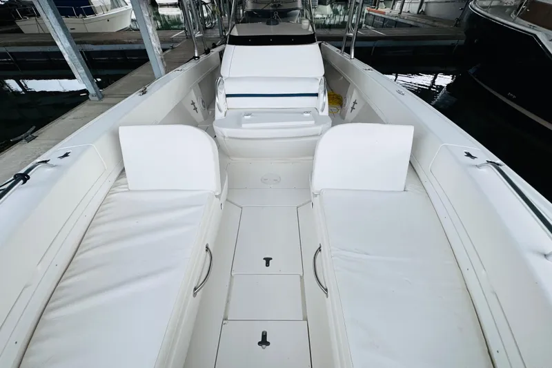  Yacht Photos Pics 2008 Intrepid 327 boat interior with white seating and storage compartments.