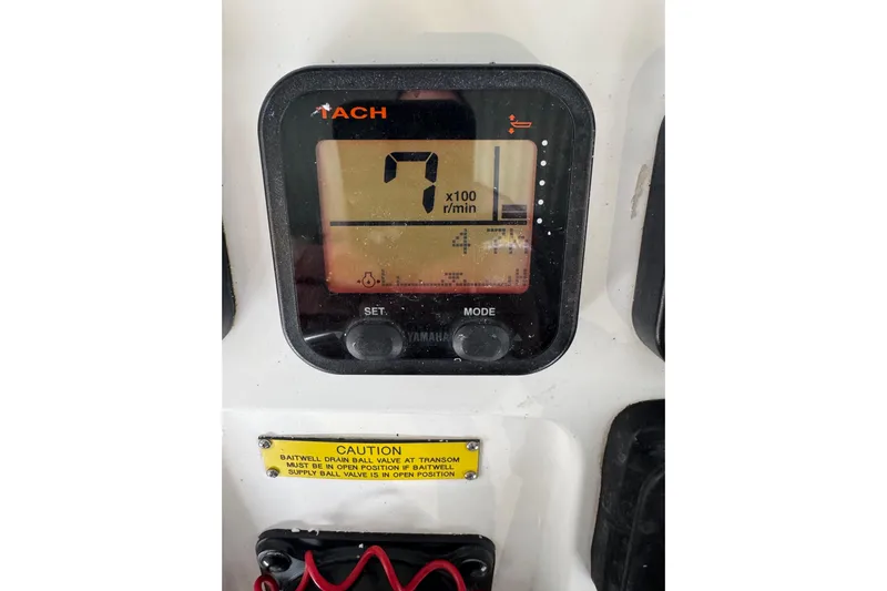  Yacht Photos Pics Yamaha tachometer display on 2008 Intrepid 327 boat, showing RPM and caution label.