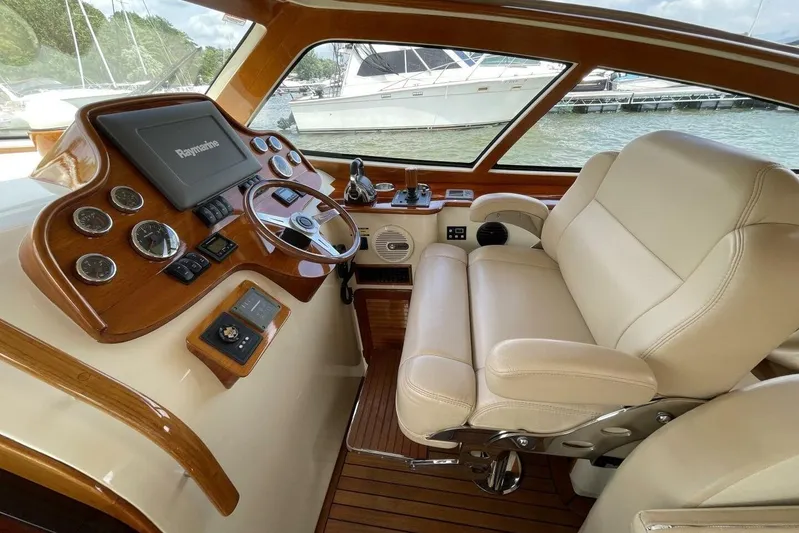 Better By Far Yacht Photos Pics Luxurious helm of 2012 Hinckley Runabout 38 with leather seating and advanced controls.
