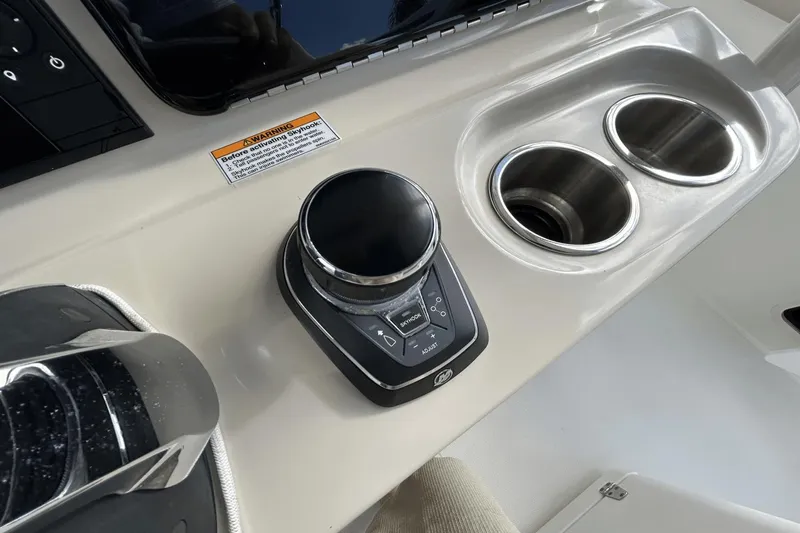  Yacht Photos Pics Control panel and cup holders on a 2018 Boston Whaler 330 Outrage boat.