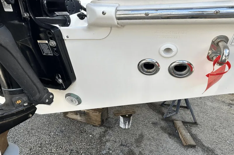  Yacht Photos Pics 2018 Boston Whaler 330 Outrage boat stern with engine and fittings.