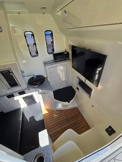  Yacht Photos Pics Interior of 2018 HCB 42 Siesta with TV and seating area.