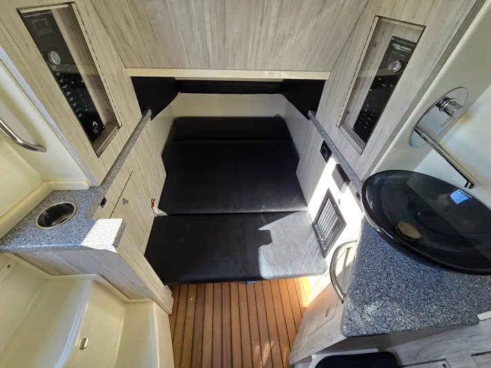  Yacht Photos Pics Interior of 2018 HCB 42 Siesta with sleeping area and wood paneling.